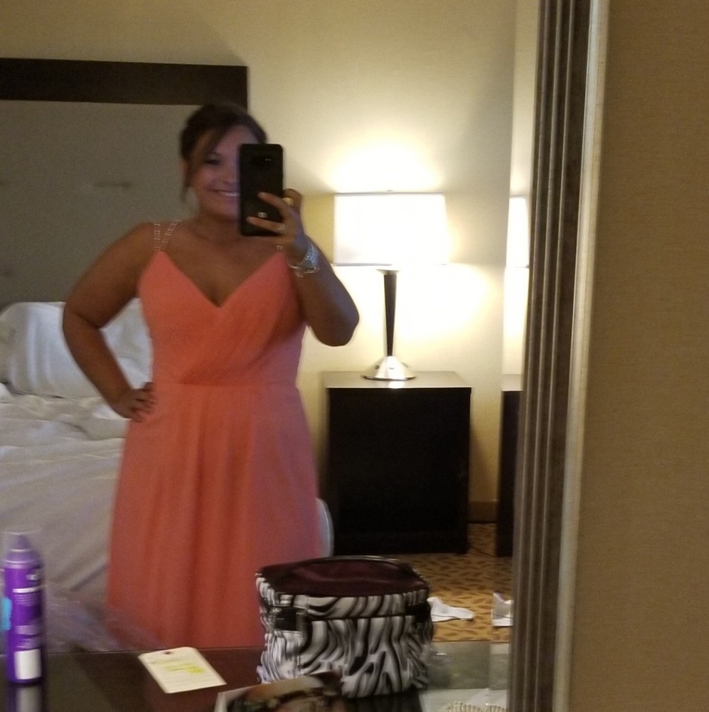 Floor length coral gown.